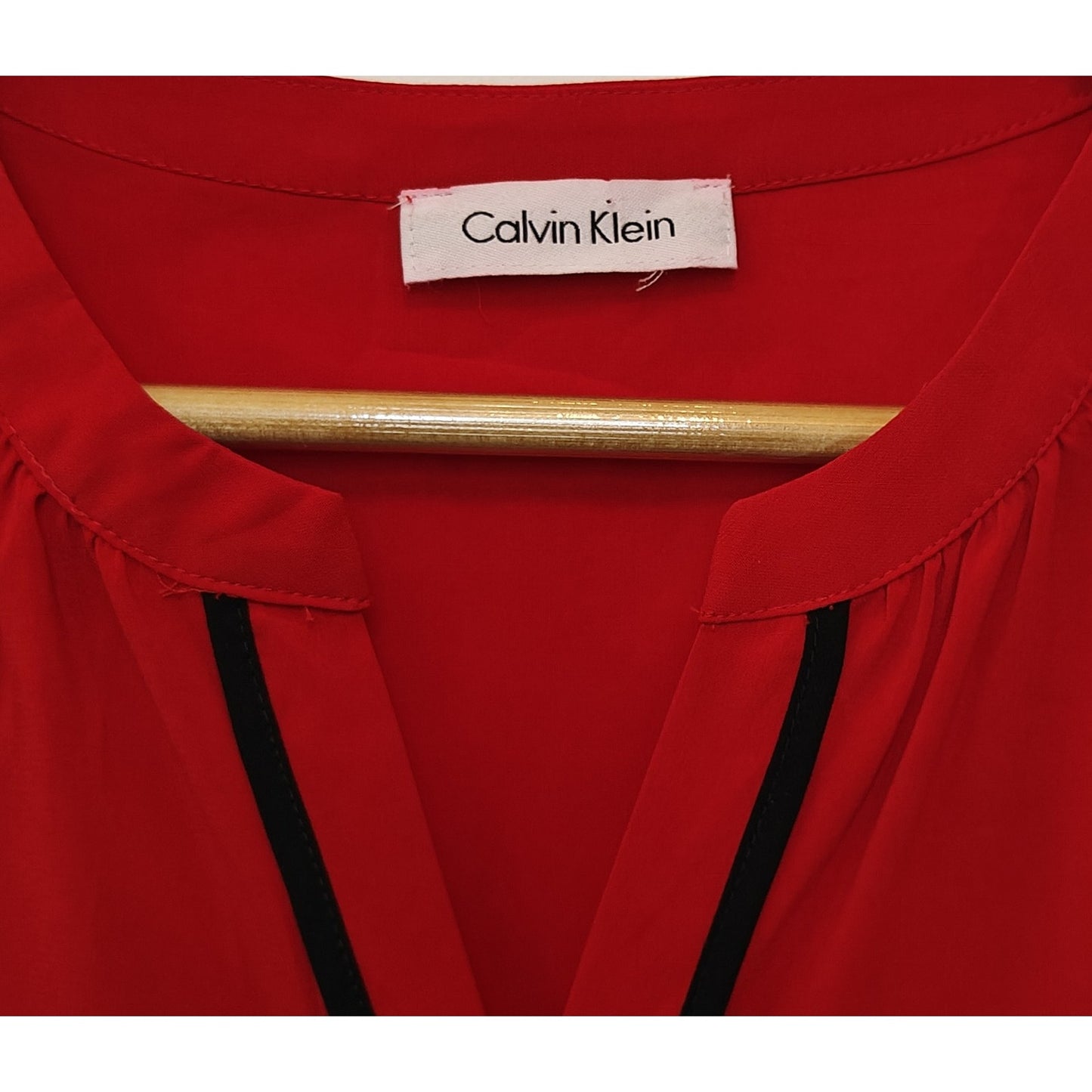 Red Sleeveless Blouse with Black Trim